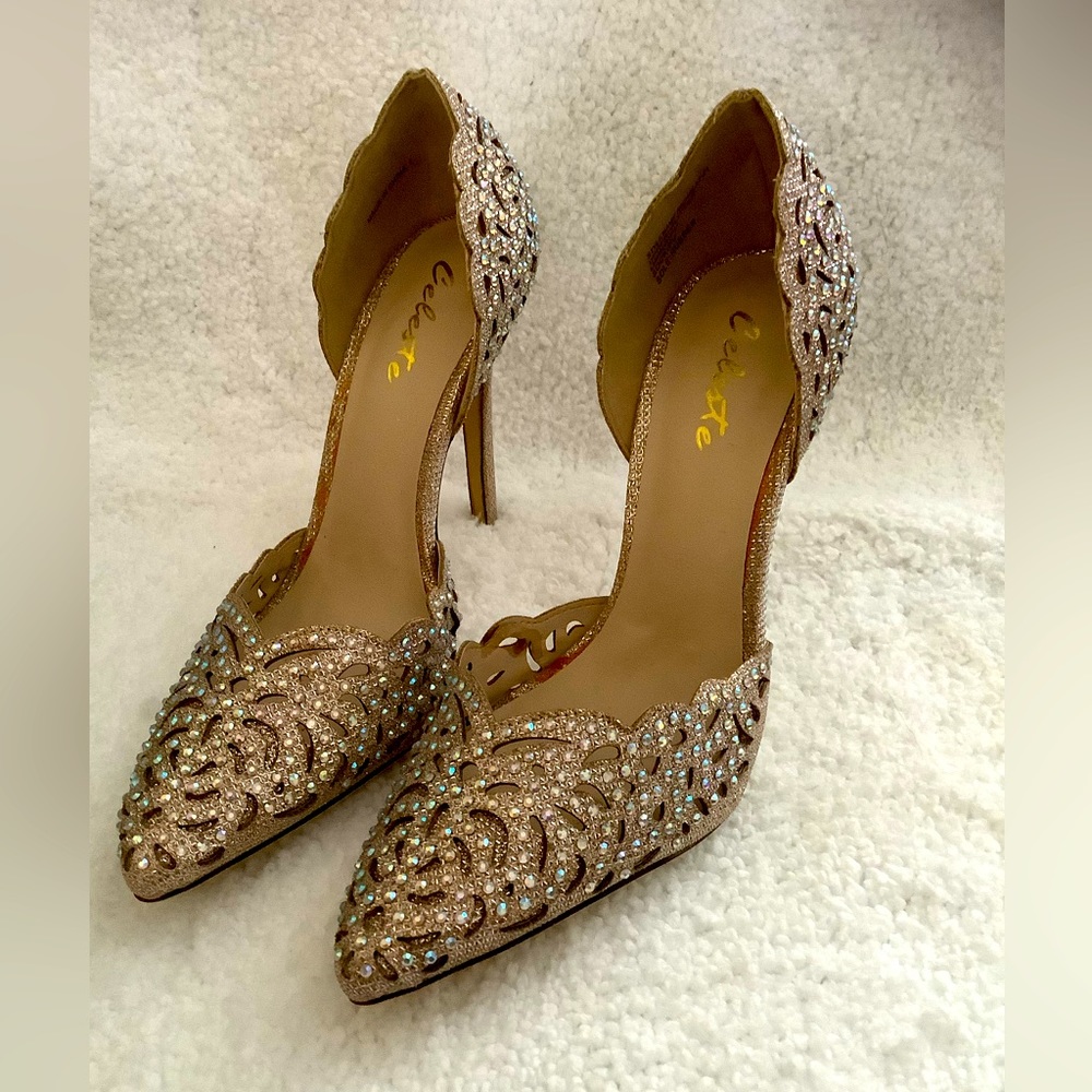 4 1/2 inch heels. Iridescent sparkle gold/beige with Cut-out design. Worn once.